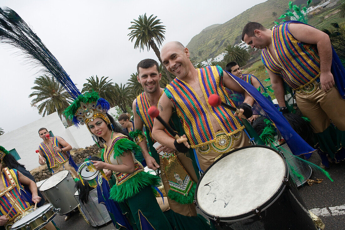 Men playing drums at carnival, dressed in costume, Haria, Lanzarote, Canary Islands, Spain, Europe