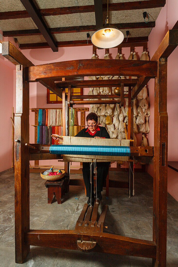 Female silk weaver sitting at a hand loom, workshop, Las Hiladeras El Paso, El Paso, La Palma, Canary Islands, Spain, Europe
