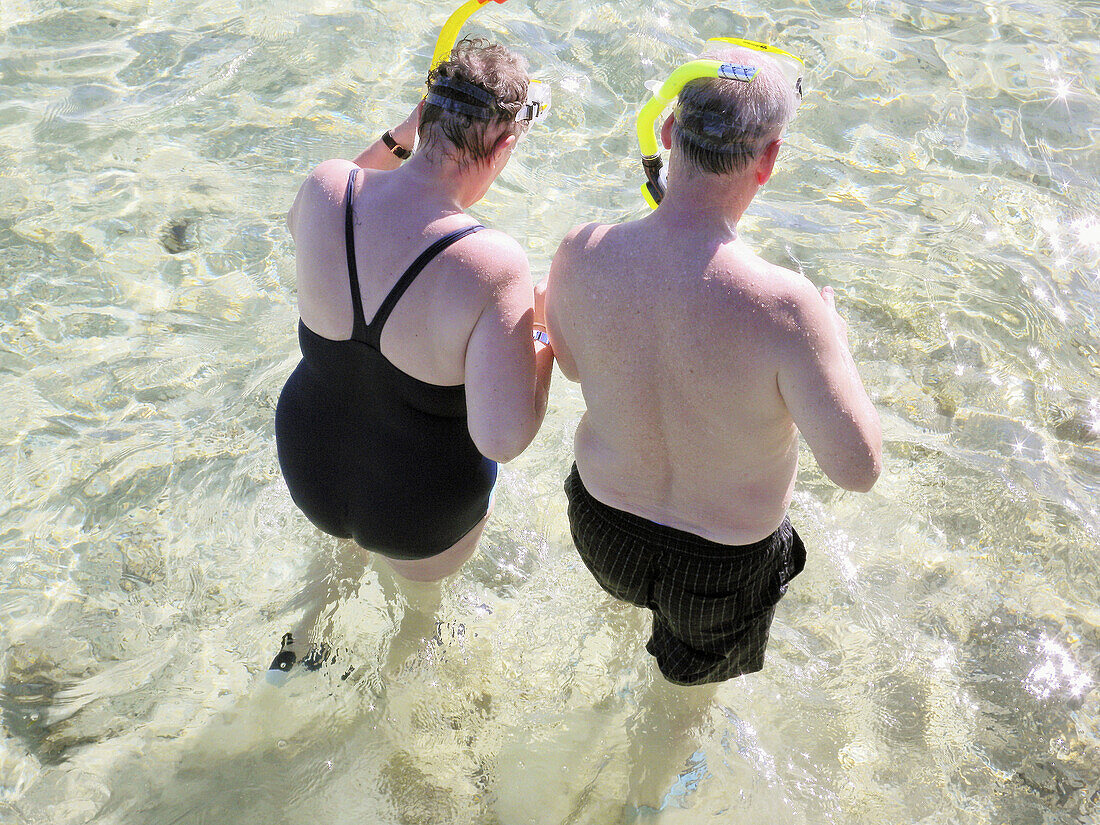 Retired tourist couple snorkeling on the beach. Sharm el-Sheikh,  Egypt