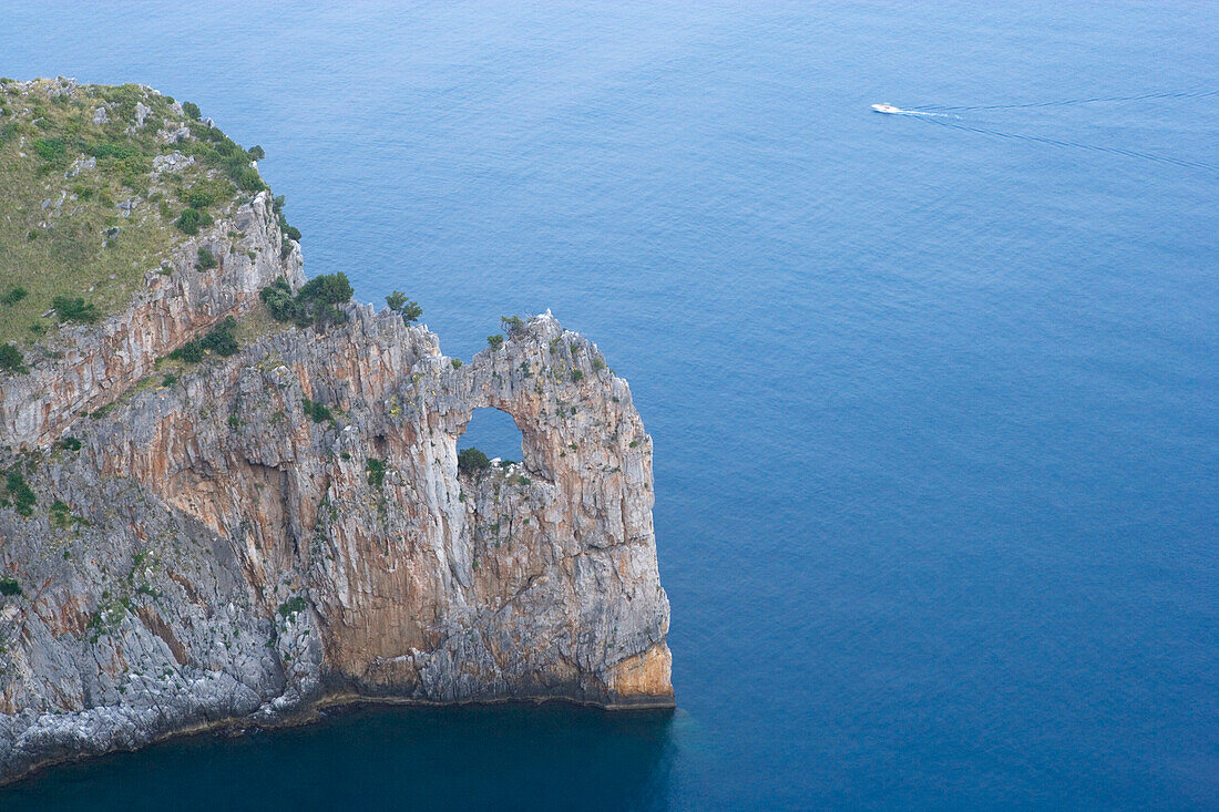 Rock arch on the coast of Cape Palinuro, Cilento, Campania, Italy