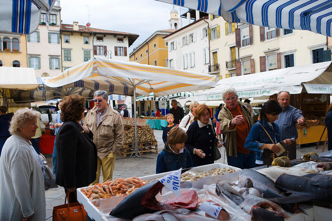 Fishmonger at the market on Piazza Mercatonuovo in Udine, Friuli-Venezia Giulia, Italy