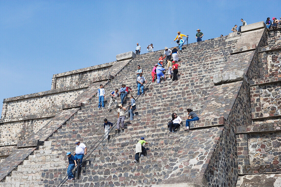 Tourists climbing the steps of the moon pyramid of Teotihuacan, Mexico City, Mexico D.F., Mexico