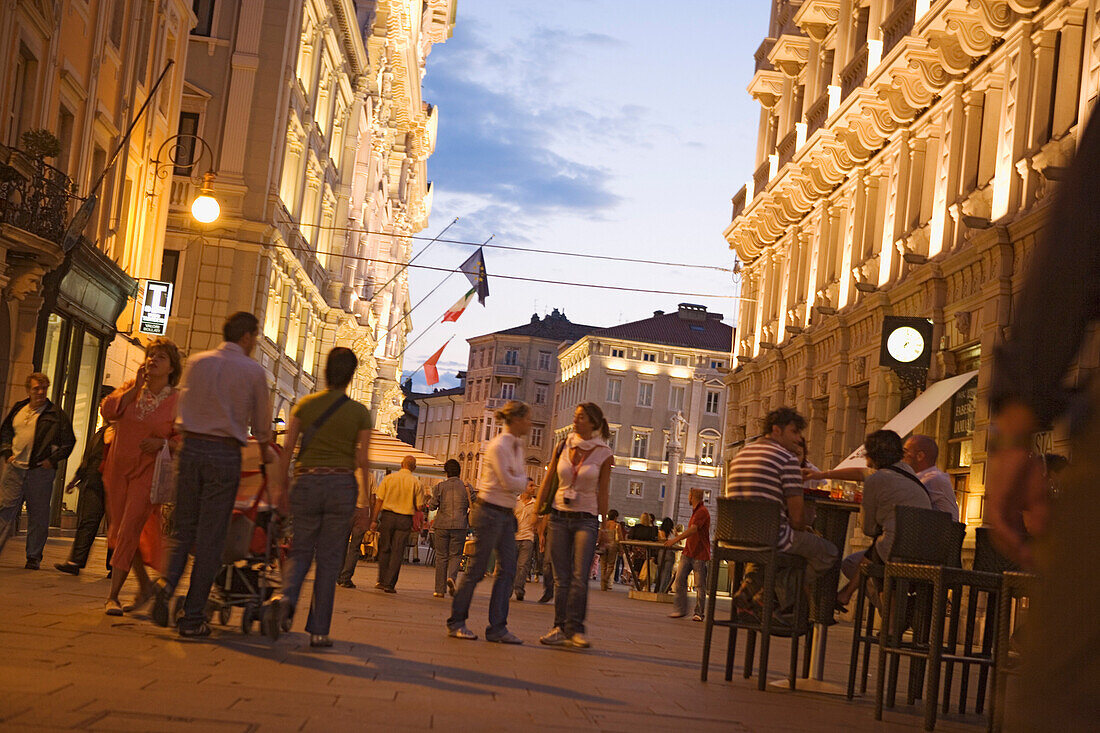 Evening on the  Via del Teatro and the Piazza dell'Unita, The bar on the right is called Ex urbanis, Trieste, Friuli-Venezia Giulia, Upper Italy, Italy