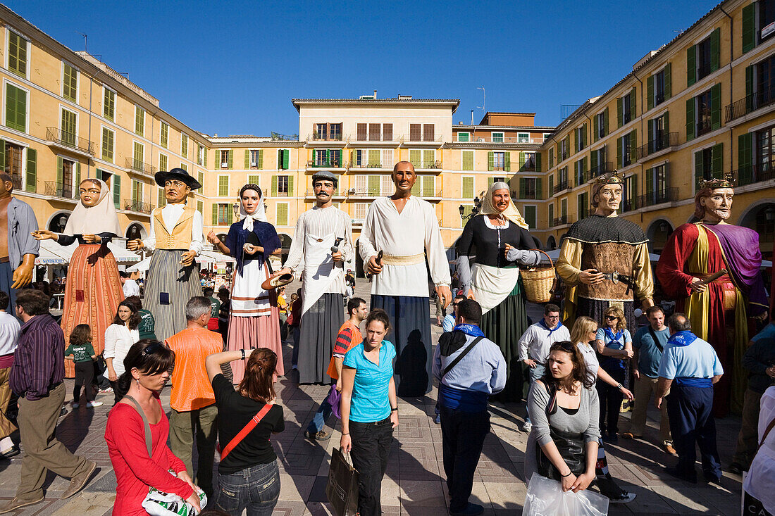 Figures with masks at a square, Diada per la Llengua, Placa Major, Palma, Mallorca, Spain, Europe