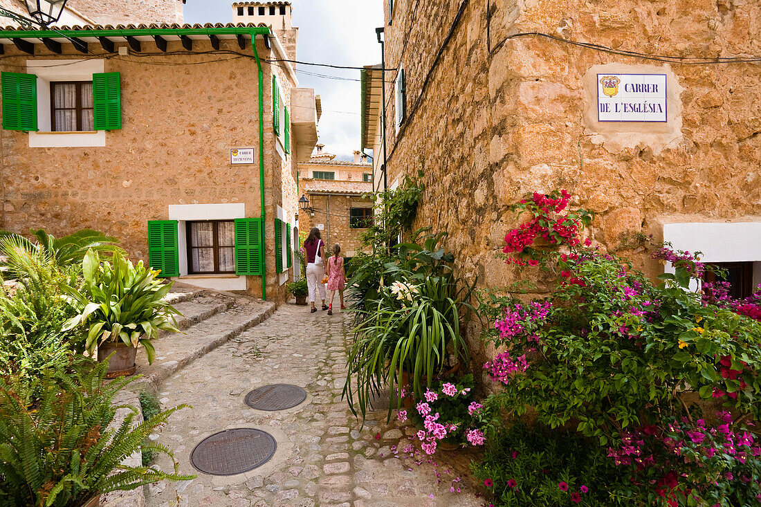Flowers and plants in an alley at Fornalutx, Mallorca, Balearic Islands, Spain, Europe