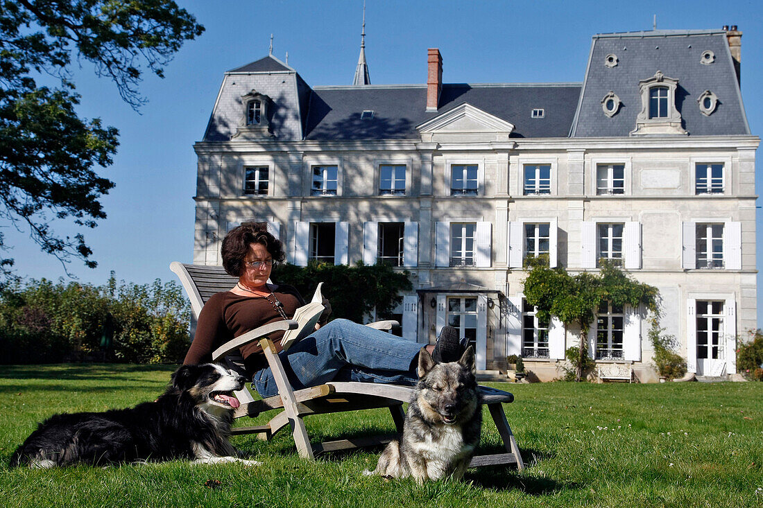 Reading In A Deckchair In Front Of The Chateau De La Puisaye, Verneuil-Sur-Avre