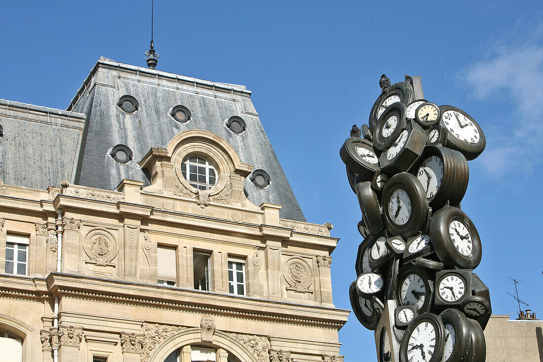 Facade Of The Gare Saint Lazare Train Station And Sculpture 'The Clocks' By The Artist Arman, Paris, France
