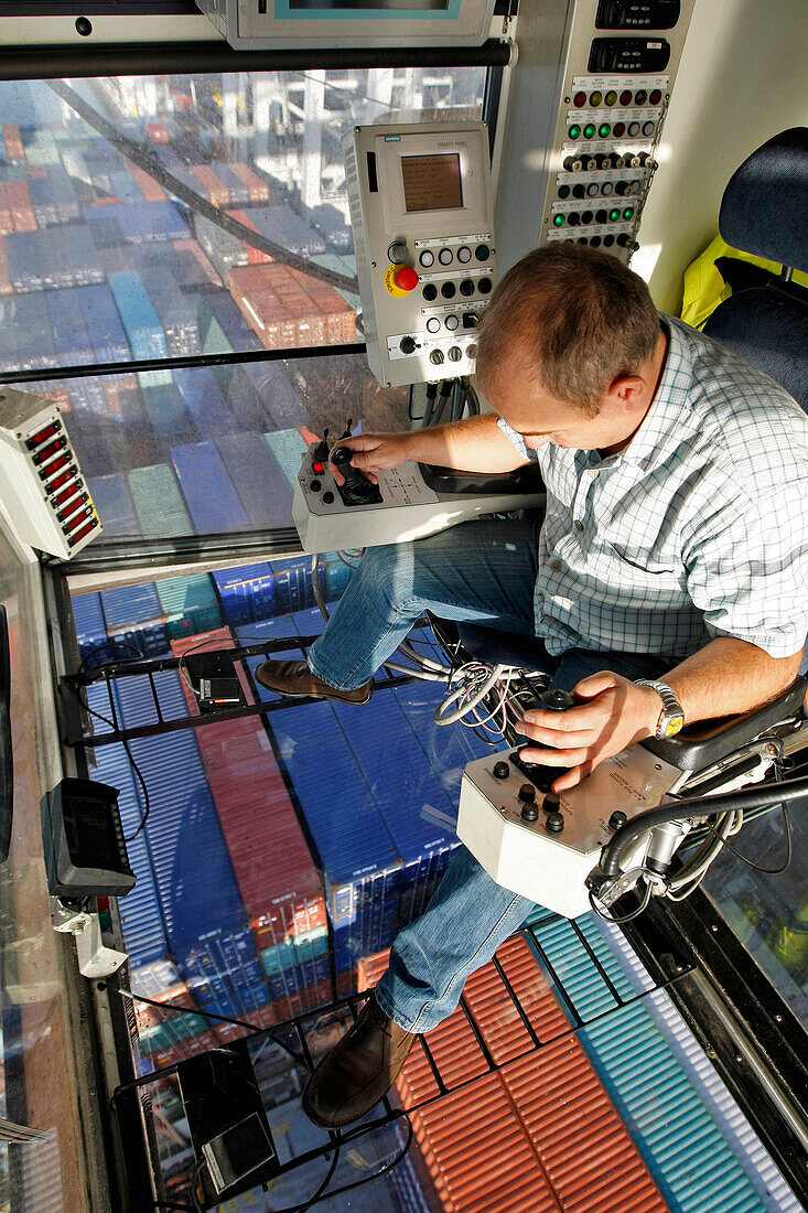 Docker Working On A Loading Gantry, Loading Of Containers Onto A Cargo Boat, Terminal Of France Port 2000, Commercial Port, Le Havre, Normandy, France