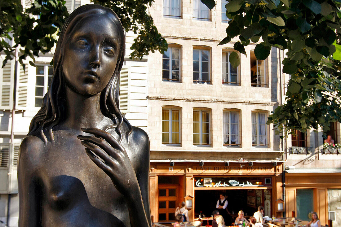 Statue Of A Bare-Breasted Woman In Front Of The Cafe De Bourg De Four, Place Du Bourg-De-Four, Geneva, Switzerland