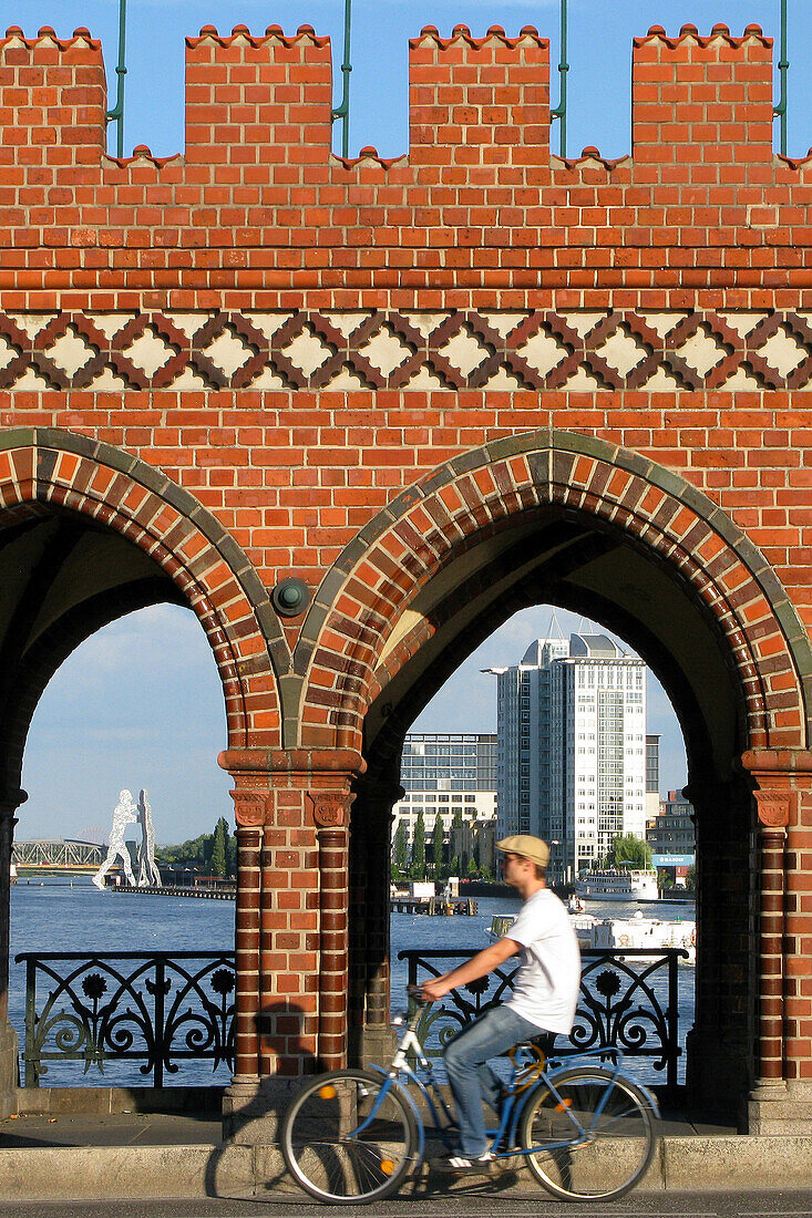 Oberbaumbrucke Bridge Over The Spree And Molecule Man In The Background, Kreutzberg Neighbourhood, Berlin, Germany