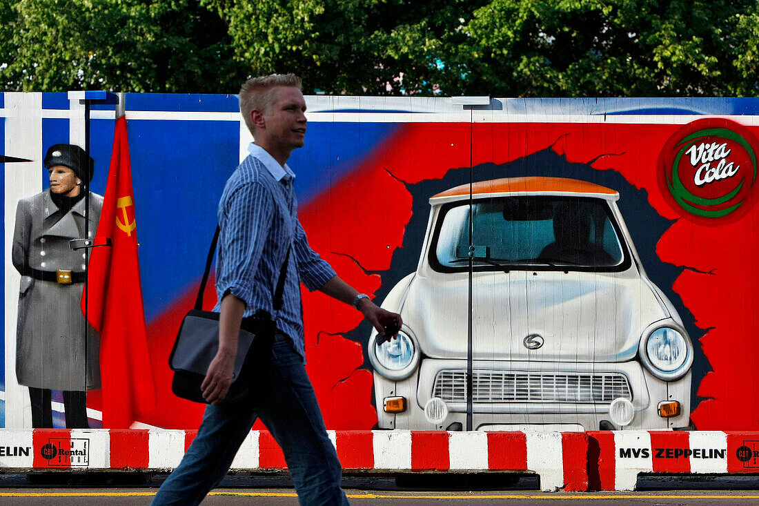 Boarded Fence Illustrating The Cold War And Checkpoint Charlie With A Trabant, Symbol Of East Germany, Berlin, Germany