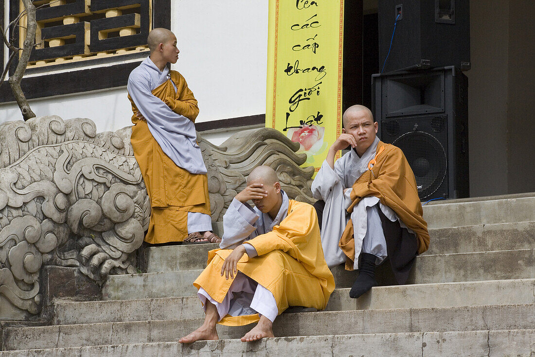 Buddhistic monks on the stairs of the Linh Son Pagoda at Dalat, Lam Dong Province, Vietnam, Asia