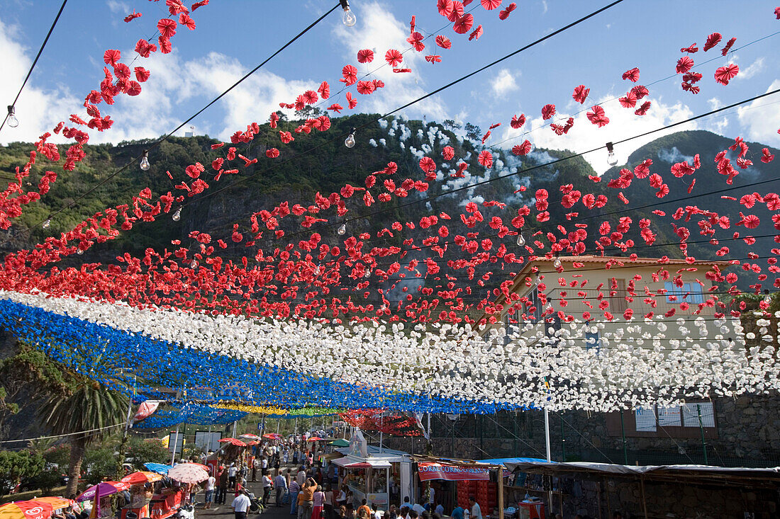Colourful decorations and firework smoke at a religious festival, Ponta Delgada, Madeira, Portugal