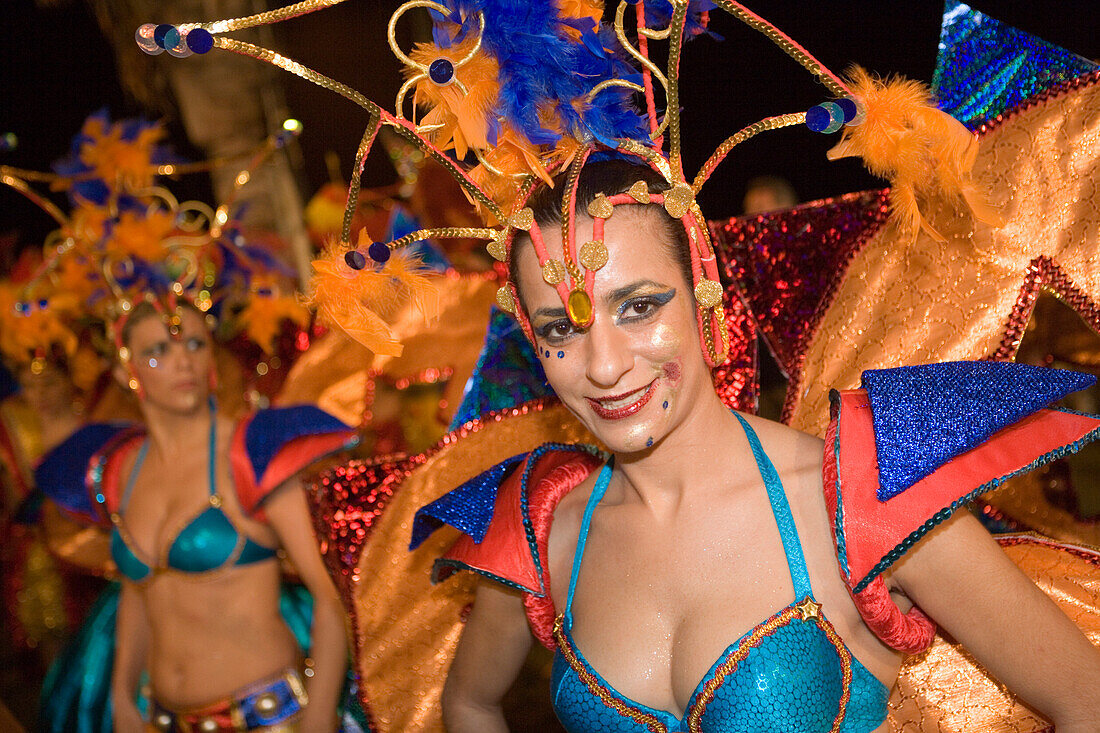 Woman in colourful costumes at the Carnival Parade, Funchal, Madeira, Portugal