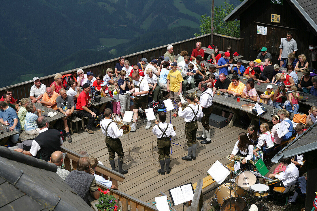 Brass band performing on alp, Styria, Austria