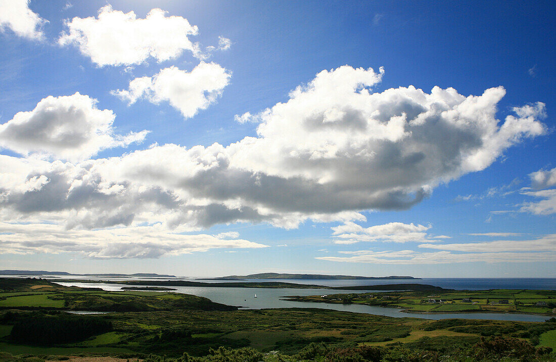 View over the Roaring Water Bay under white clouds, Mizen Head Peninsula, County Cork, southwest coast, Ireland, Europe