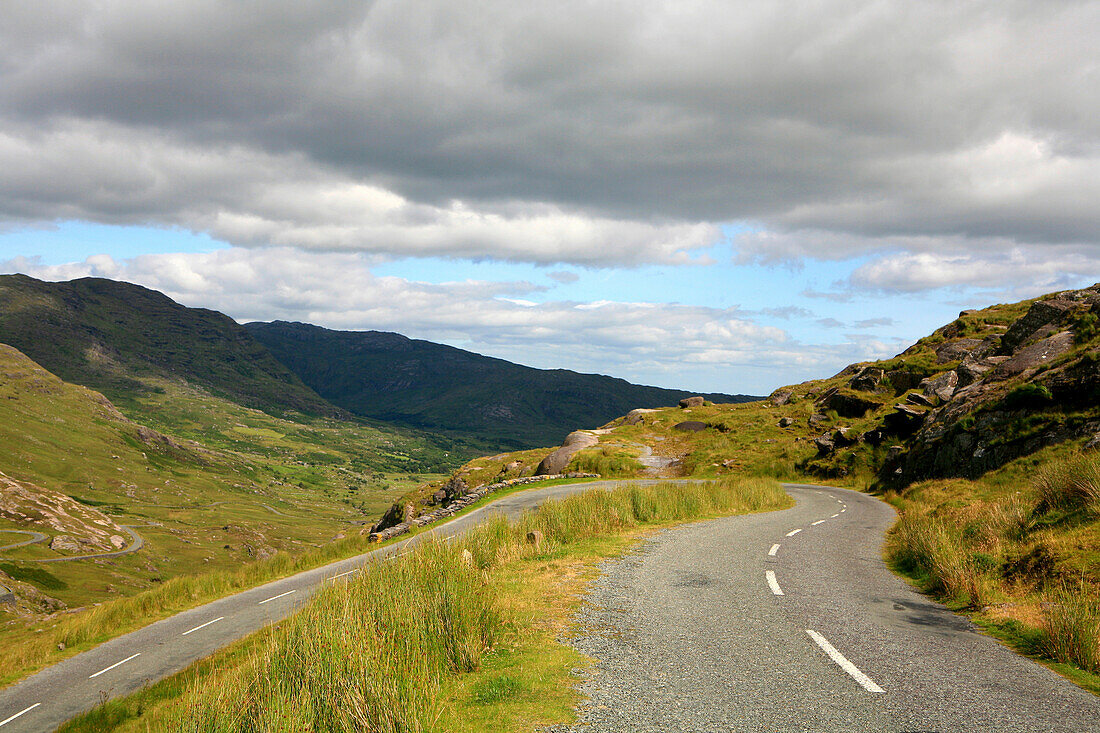 Healy Pass crossing the Caha Mountains under grey clouds, Beara Peninsula, County Cork, southwest coast, Ireland, Europe