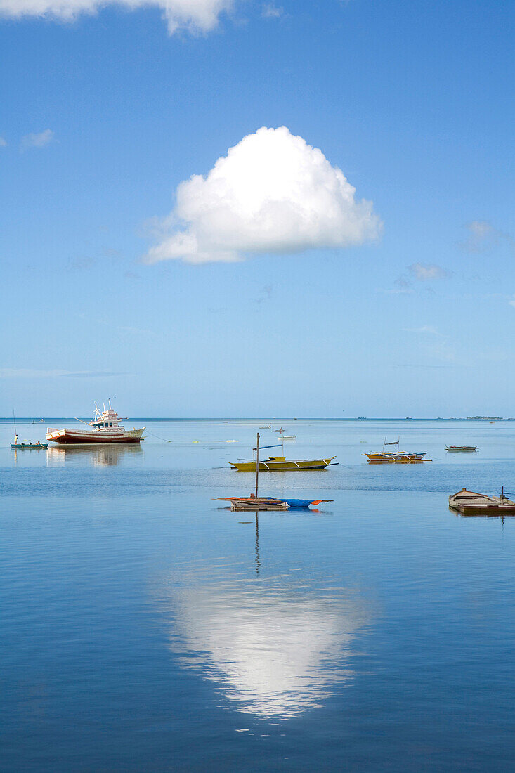 Boats at the port of Bantayan under white cloud, Cebu, Visayas, Philippines, Asia