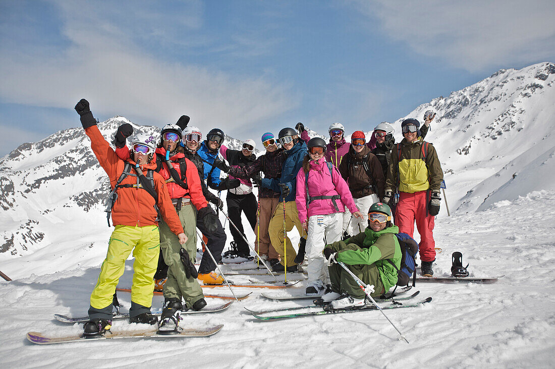 Group of snowboarders and skiers in snow, See, Tyrol, Austria