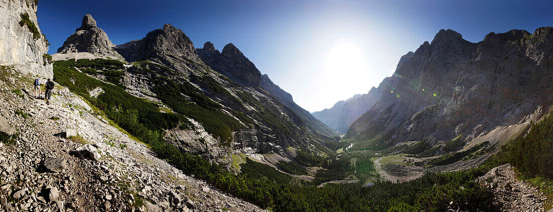 Two hikers ascenting mount Zugspitze, Wetterstein Range, Bavaria, Germany