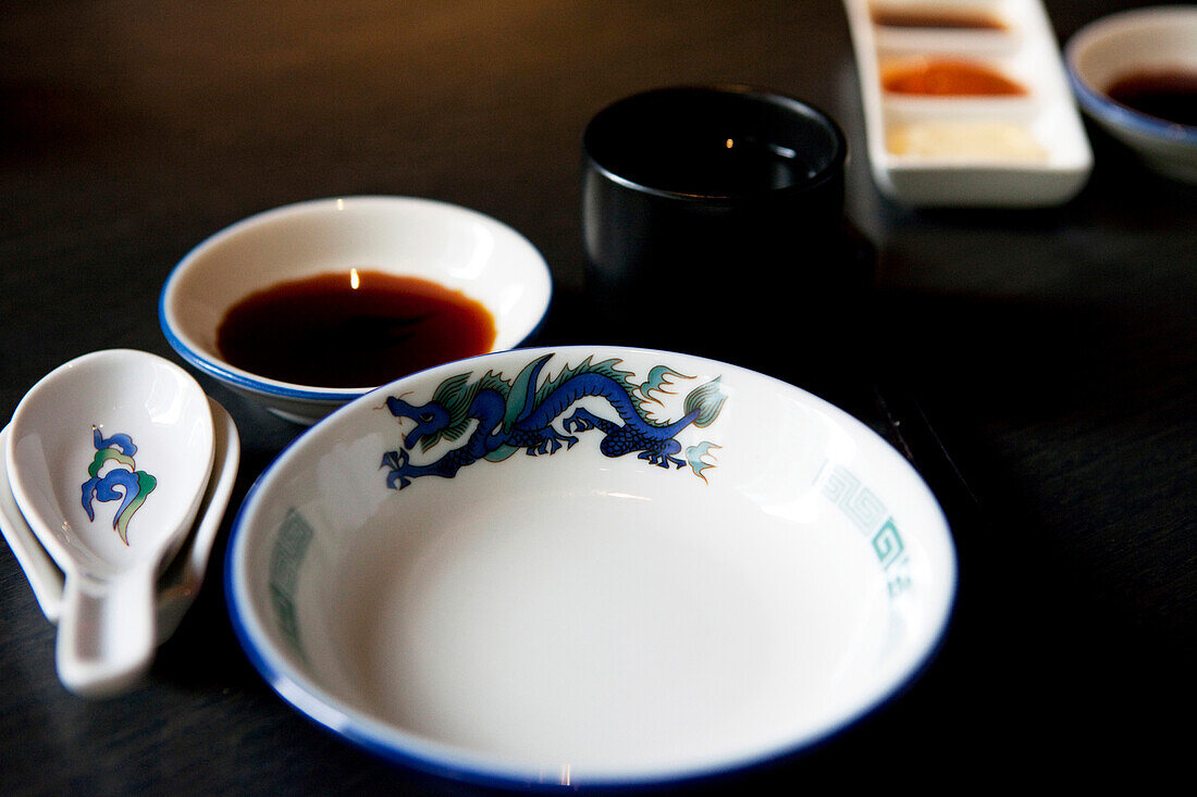 Table with bowl and soy sauce in Dim Sum restaurant Red Dragon, Hong Kong, China