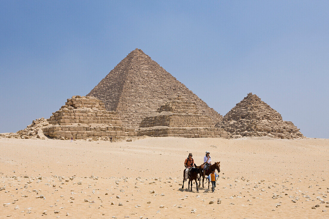 Pyramid of Menkaure and three small Pyramids of Queens, Egypt, Cairo
