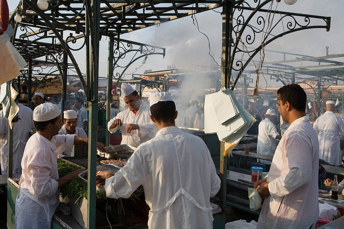 Chefs at a food stall on Djemaa el Fna Square, Marrakesh, Morocco, Africa