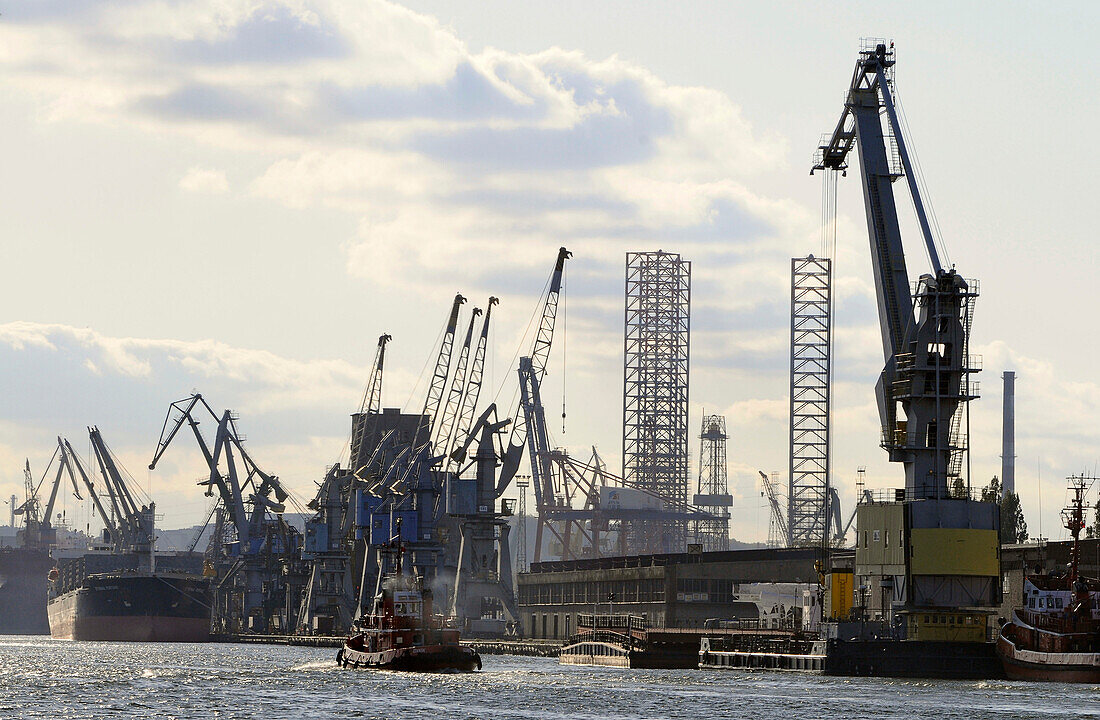 Harbour and dockyard under clouded sky, Gdansk, Poland, Europe