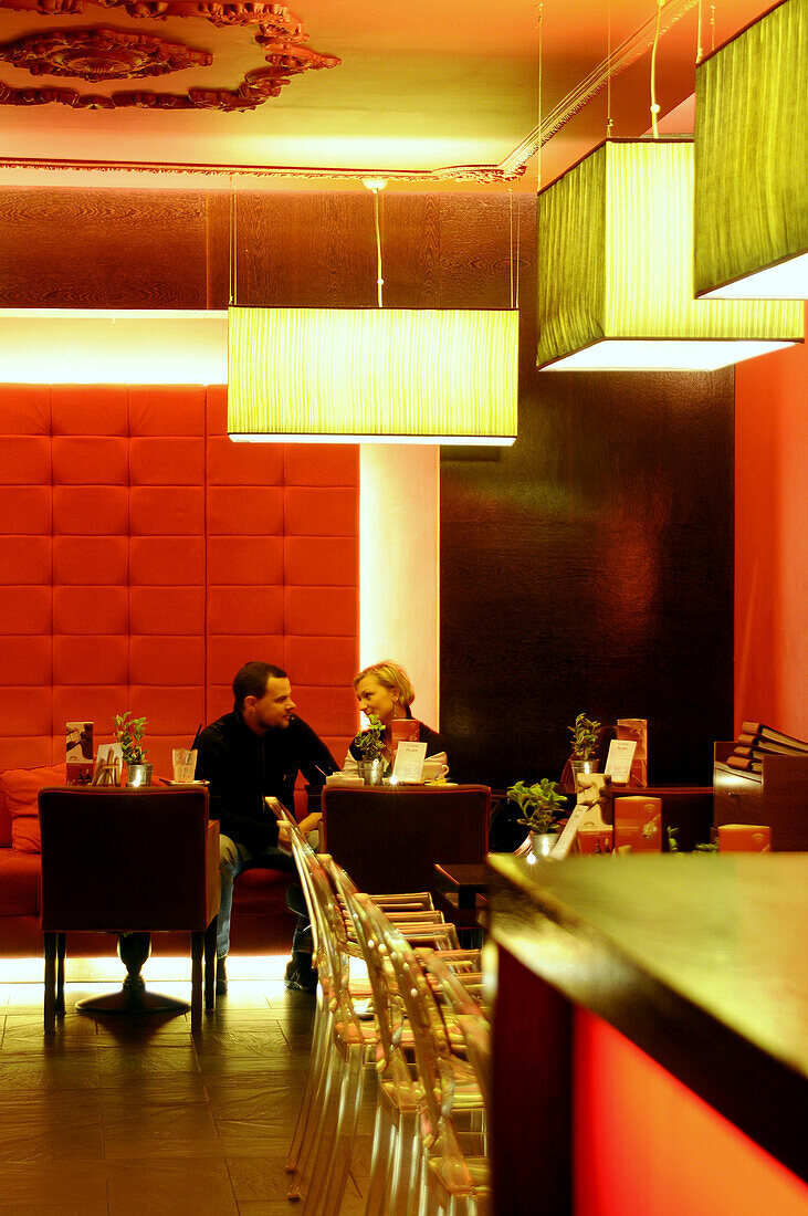 A couple sitting at a table at cafe Felber, Gdansk, Poland, Europe