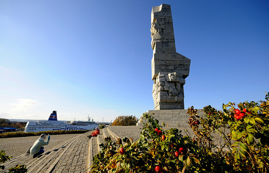 Woman and child at the Westerplatte monument in the sunlight, Poland, Europe