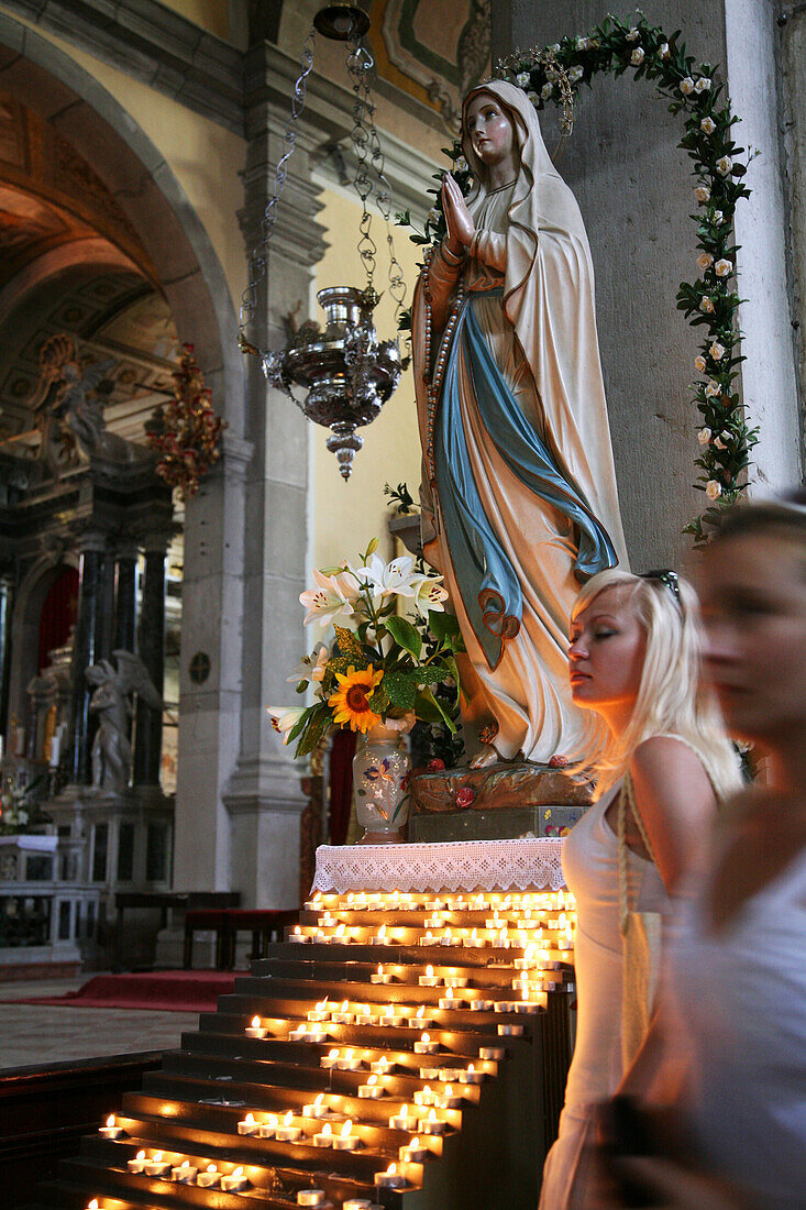 Town Of Rovinj, Young Blond Woman Near The Statue Of The Virgin Mary In The Sainte-Euphemie Church, Istria, Croatia