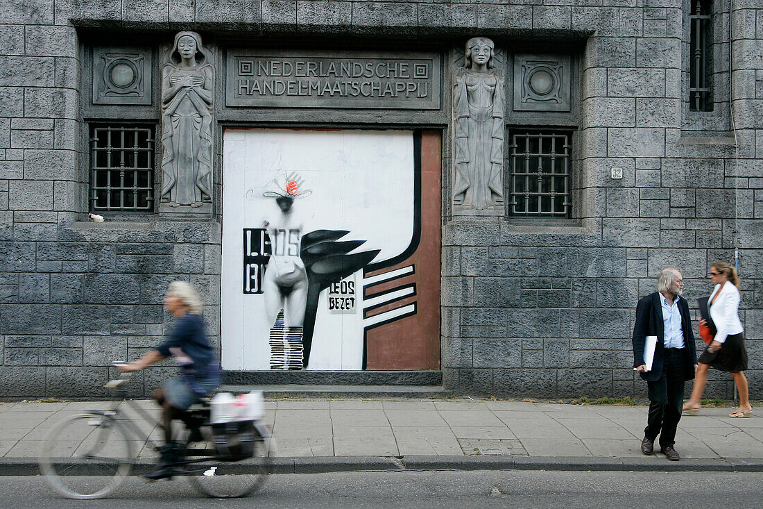 Bicycles And Passers-By In Front Of The Facade Of The Building Designed By K. De Bazel, Amsterdam, Netherlands