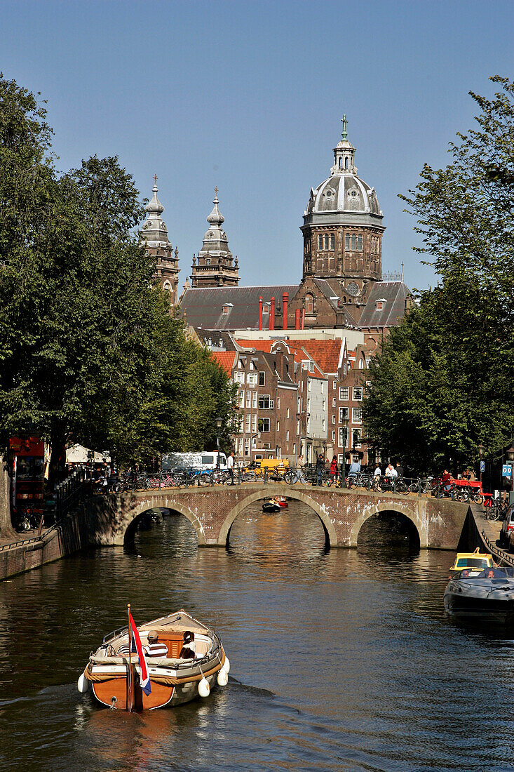 Oudezuds Voorburgwal Canal With The Church 'Saint Nicolas Kerk, Amsterdam, Netherlands