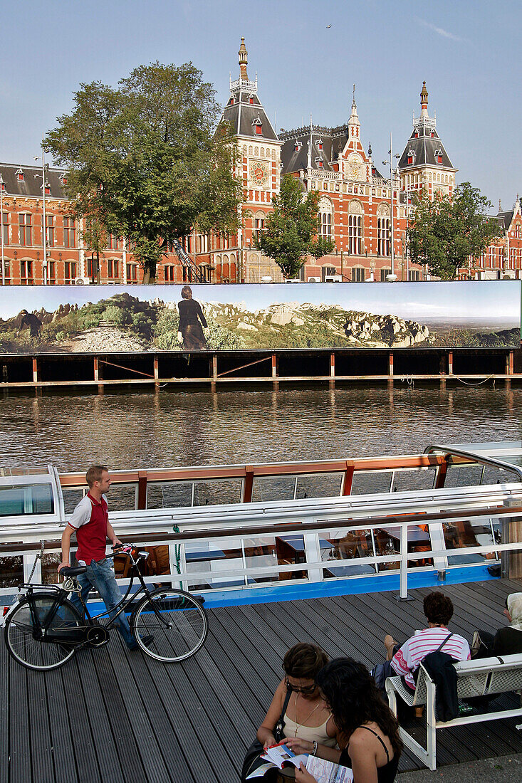Pier For Boat Rides On The Canals In Front Of The Main Train Station, Amsterdam, Netherlands