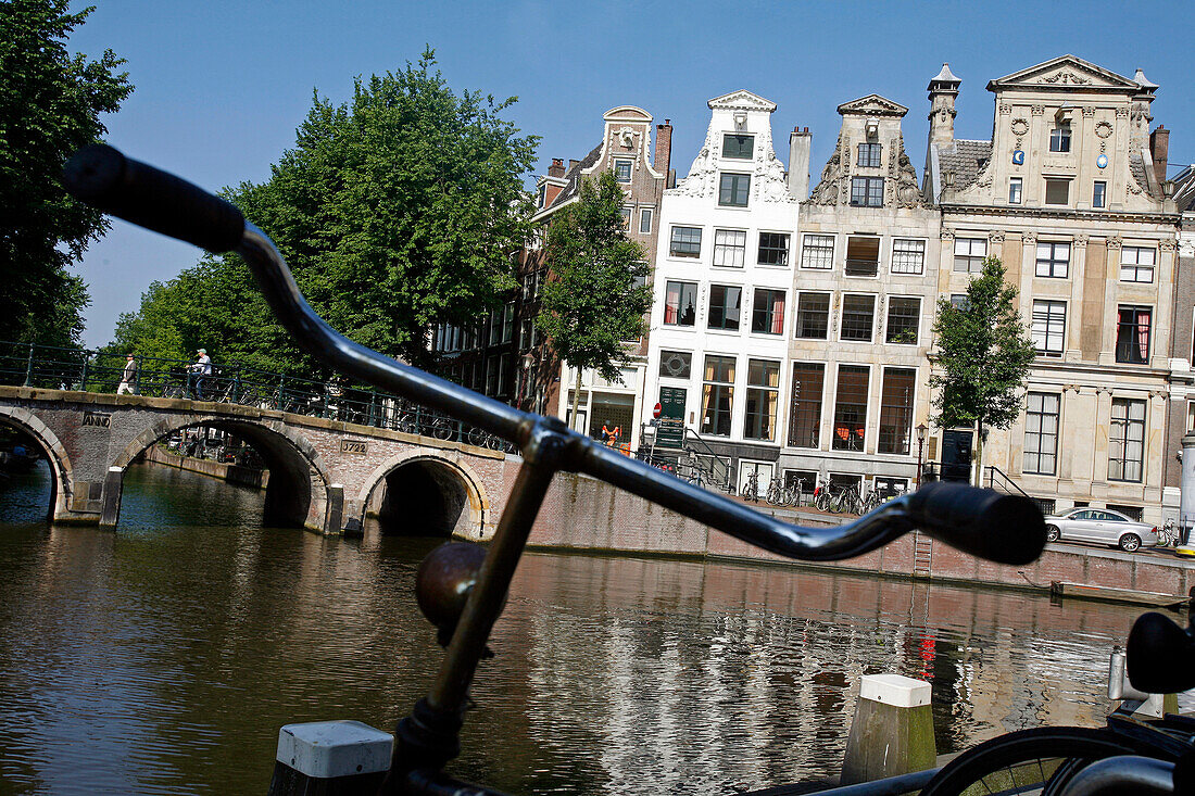 Dutch Bicycle And Traditional Houses Along The Canals, Amsterdam, Netherlands, Holland