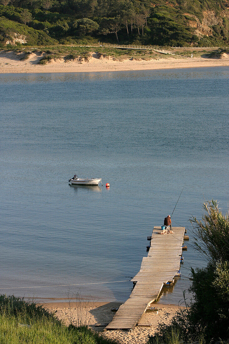 Pleasure Boat And Fisherman On A Pontoon, Mouth Of The Rio Mira, Vila Nova Das Milfontes, Alentejo, Portugal