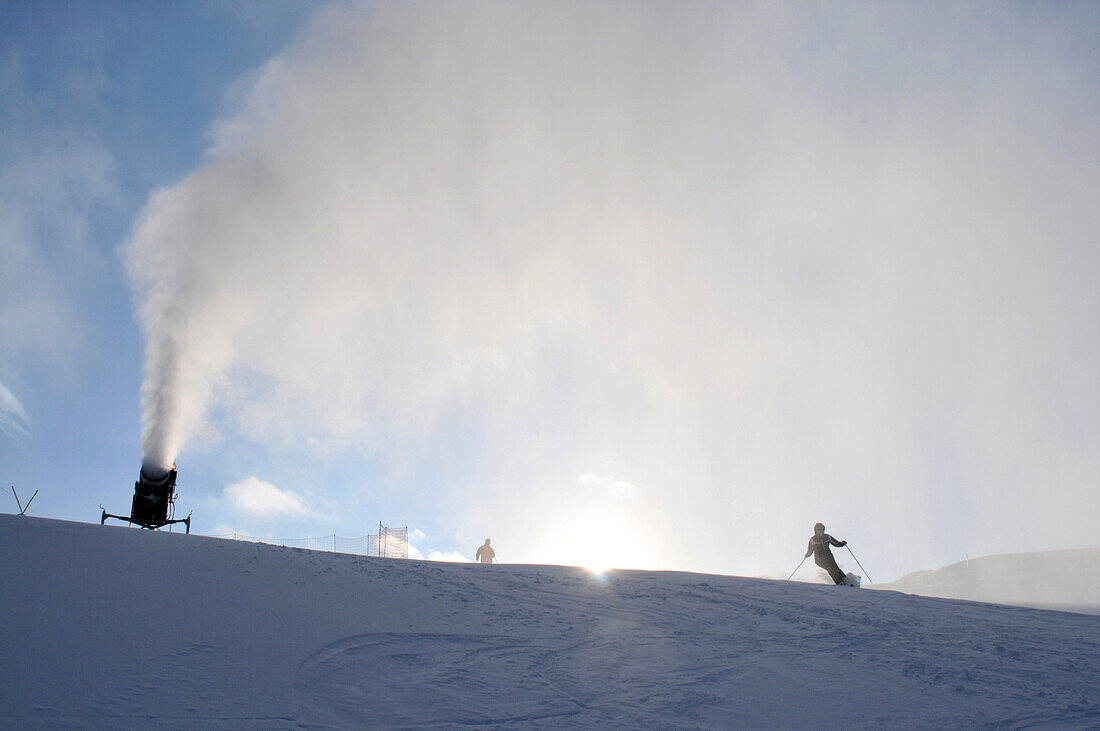 Skiing at Piz Corvatsch, snow cannon in background, near St. Moritz, Engadin, Grisons, Switzerland