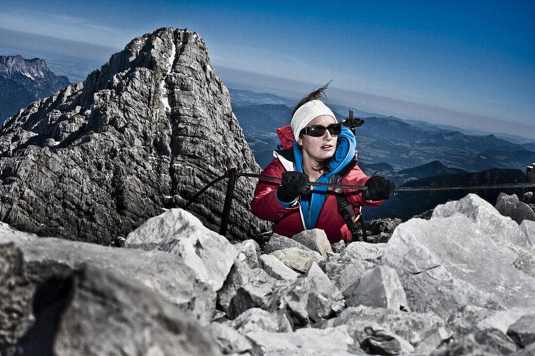 Woman climbing at fixed rope route, Watzmann, Berchtesgaden Alps, Berchtesgaden, Bavaria, Germany