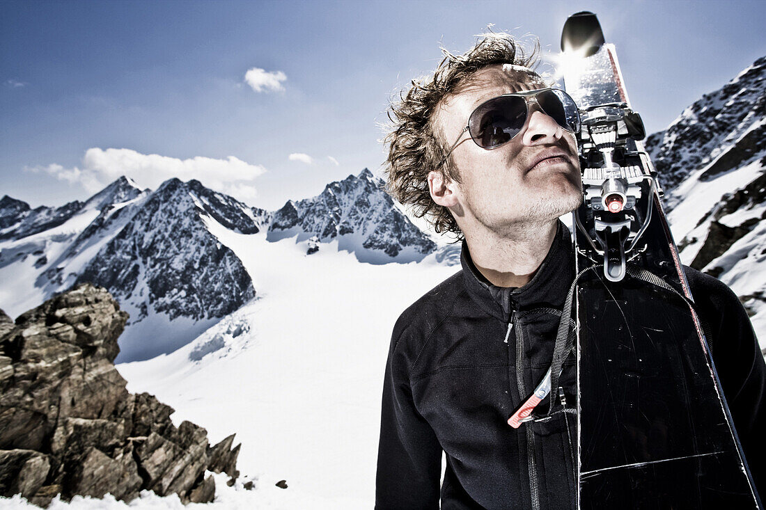 Man with telemark-skis on shoulder, Stubai Alps, Tyrol, Austria