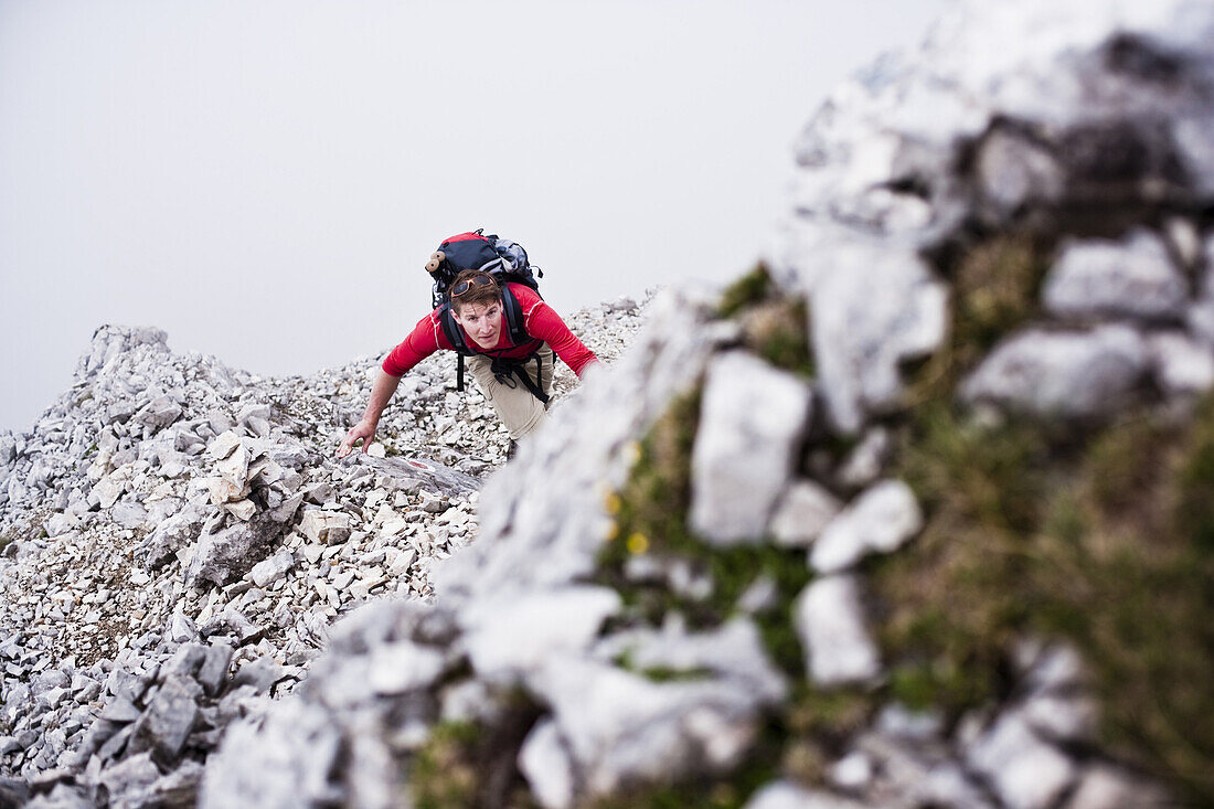 Man ascenting Sonntagkarspitze, Innsbruck, Karwendel range, Tyrol, Austria