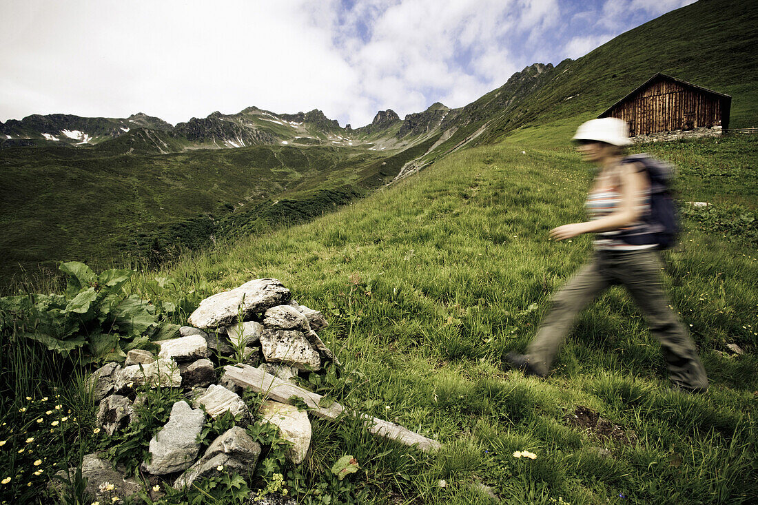 Woman hiking, Obere Roebi Alm, Gargellen, Montafon, Vorarlberg, Austria