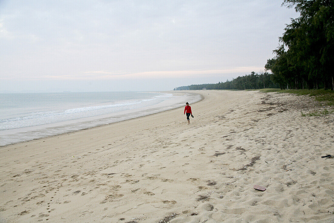 Person on the beach of Mazu island at dusk, Meizhou Island, Fujian province, China, Asia