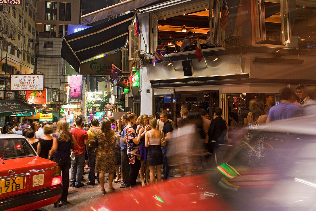 People on the street in front of a bar, Lan Kwai Fong, Hongkong, China, Asia