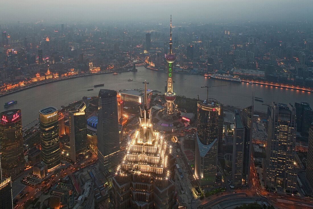 View at illuminated Jin Mao Tower, city and Huangpu river in the evening, Bund, Pudong, Shanghai, China, Asia