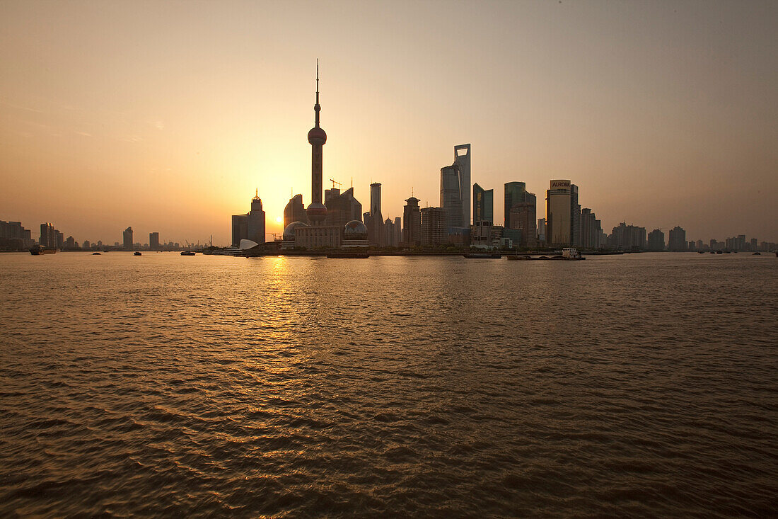 Skyline of Pudong at Huangpu river at sunrise, Pudong, Shanghai, China, Asia