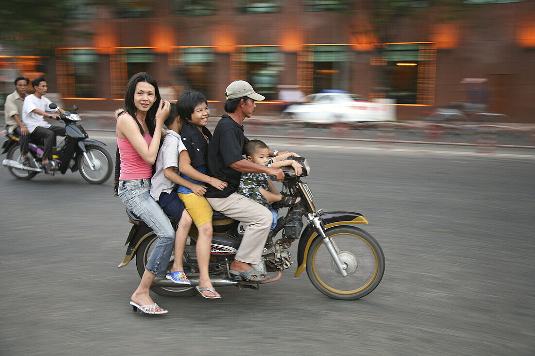 Familiy with children on a scooter, Tet festival, Saigon, Ho chi Minh City, Vietnam, Asia