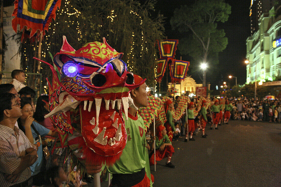 People at dragon dance during Tet festival at night, Saigon, Ho Chi Minh City, Vietnam, Asia