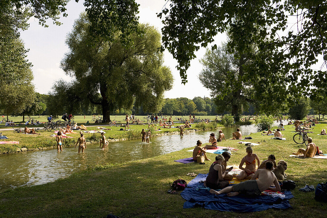 People sunbathing in English Garden, Munich, Bavaria, Germany, Europe