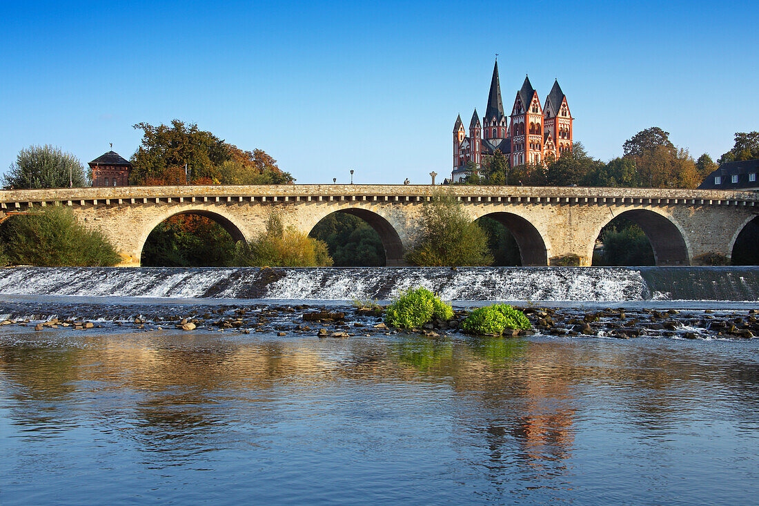 View over Lahn river with bridge to cathedral, Limburg, Hesse, Germany