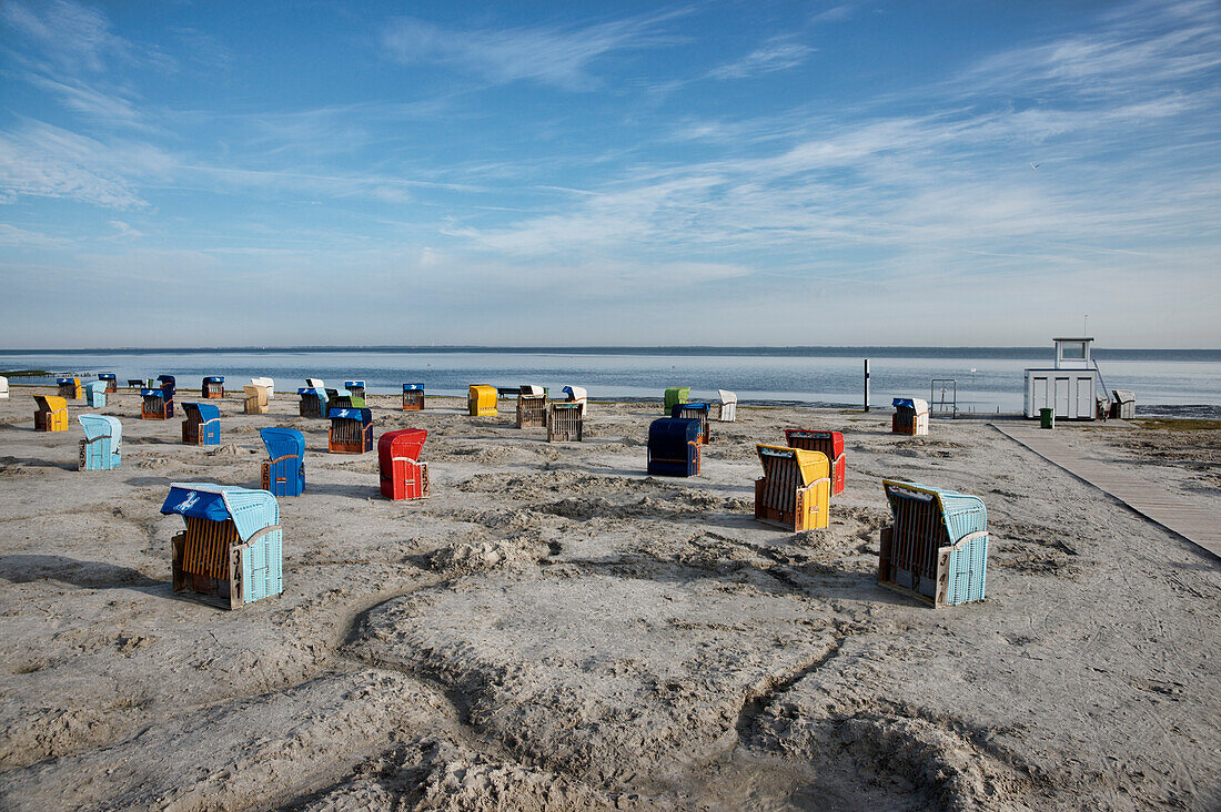 Roofed wicker beach chairs at beach, Carolinensiel-Harlesiel, East Frisia, Lower Saxony, Germany